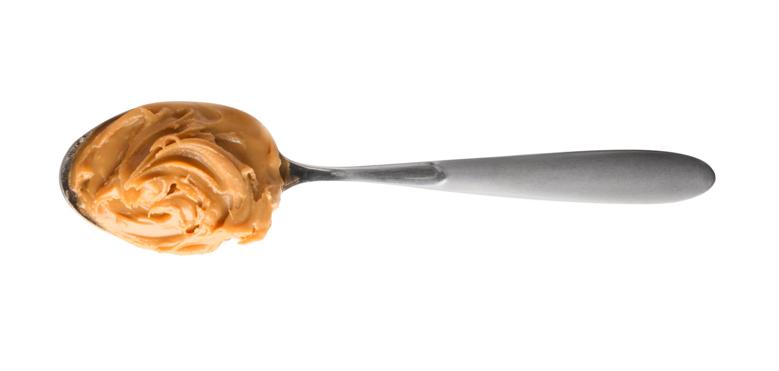 Spoon with peanut butter on it